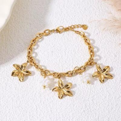 BRACELET - FLEURS ET PERLES - ACIER INOXYDABLE